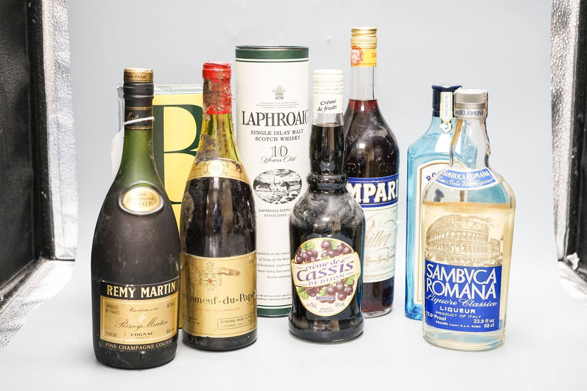 A Laphroaig whisky, a Remy Martin cognac and sundry unopened bottles